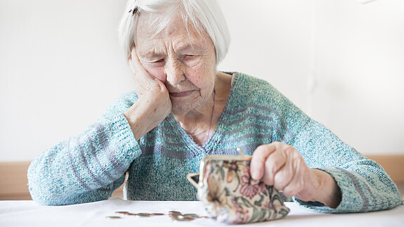 Concerned elderly woman sitting at the table counting money in her wallet. senior, pensioner, elderly, woman, wallet, poverty, retirement, old, empty, coins, background, money, miserable, broke, lonely, alone, poor, purse, aged, problem, concept, female, finance, financial, pension, adult, care, cash, donation, emotion, hand, leather, person, sad, sitting, table, debt, holding, age, bankrupt, business, buy, closeup, counting, bill, portrait, survival, caucasian, 90s, hopeless