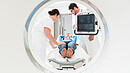 Doctor, physician, nurse, medical, specialist, radiology, radiologist, man, woman, Patient, hospital, clinic, medical team, Team, Teamwork, working, MRI, MRT, CT, computer tomography, imaging, magnetic resonance imaging, tomography, tomograph, x-ray, equipment, tube, scan, CT scan, Diagnostics, diagnose, screen, explaining, showing, care, health, healthcare, disease, medicine, people, staff, professionals, occupation, Caucasian, adult, standing, confident, white, young, competent